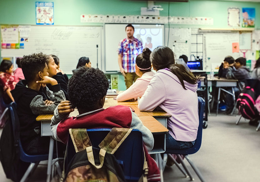 Teacher in front of classroom